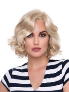 headshot of model wearing blonde chin length wig