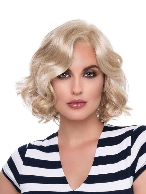 headshot of model wearing blonde chin length wig