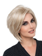 headshot of model wearing blonde bob style wig
