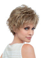 headshot of model wearing dirty blonde spiky wig