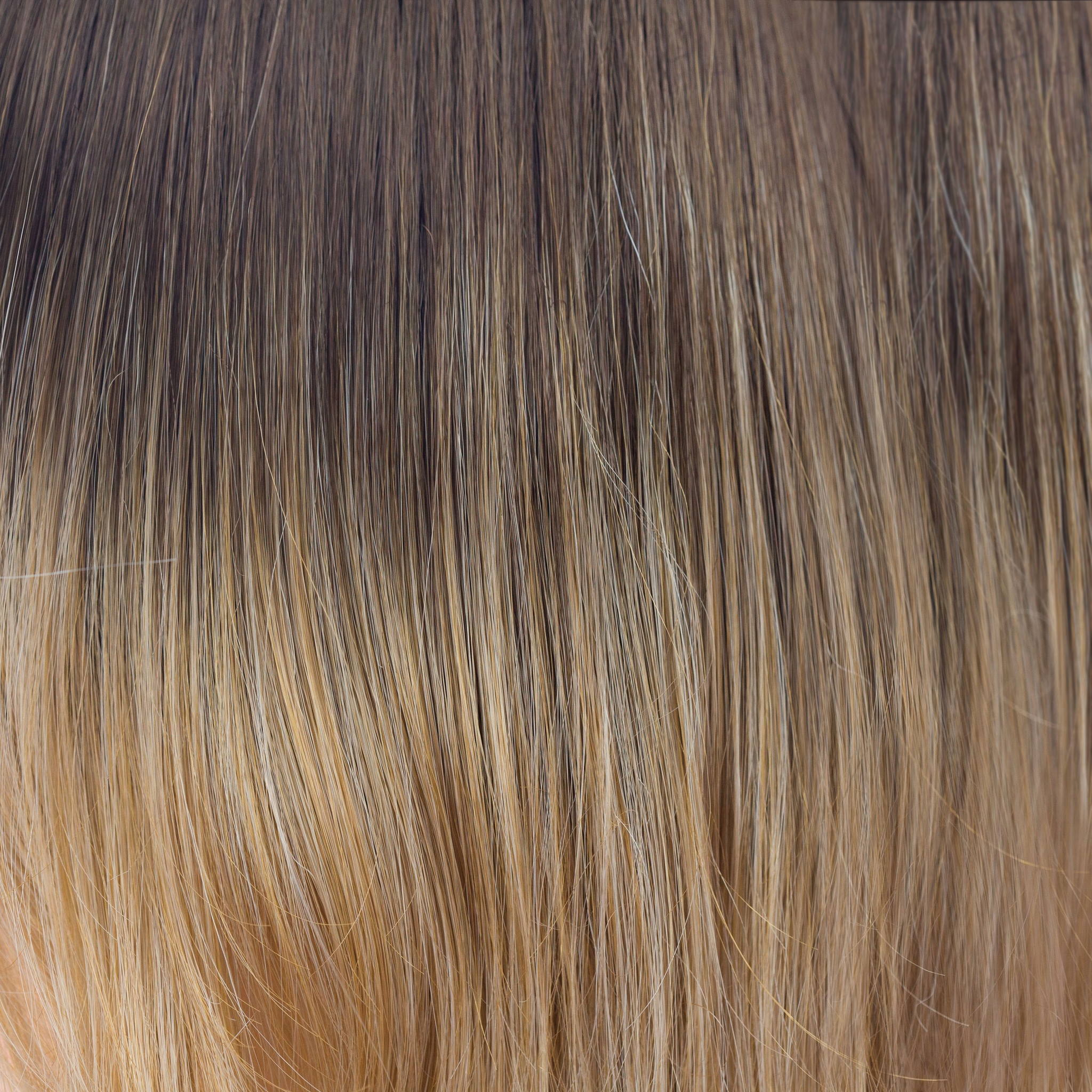 Banana Split-LR  -  A long chocolate root which blends into golden yellow slices with banana blonds running toward the ends. A flattering ombre that enriches your complexion.