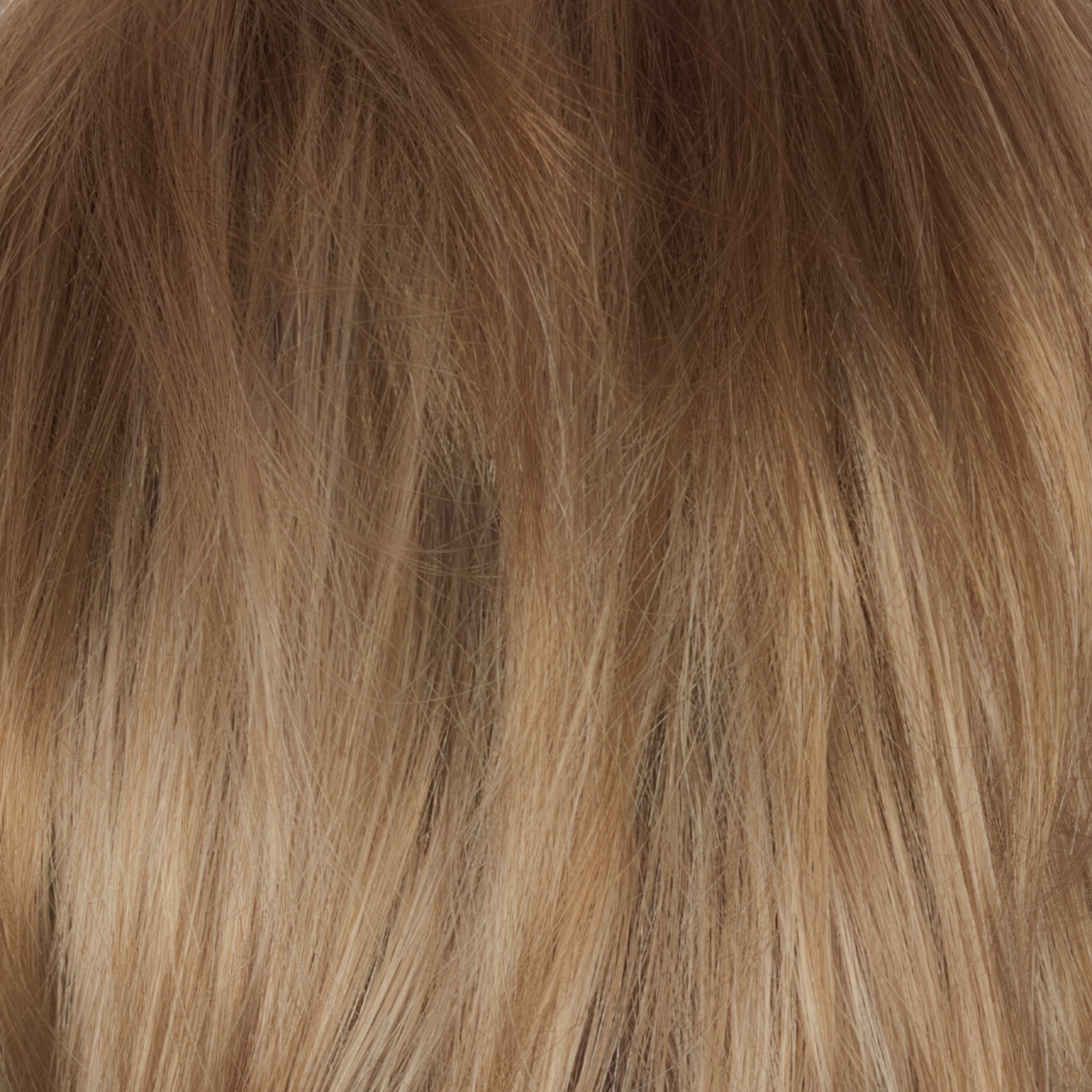 Champagne Sunset - A luxurious dark/medium multi-tonal blond with a chocolate brown root regrowth Â that captures the essence of a summer sunset. This beautiful color is ideal for those who appreciate textured honey, ash and gold hues.