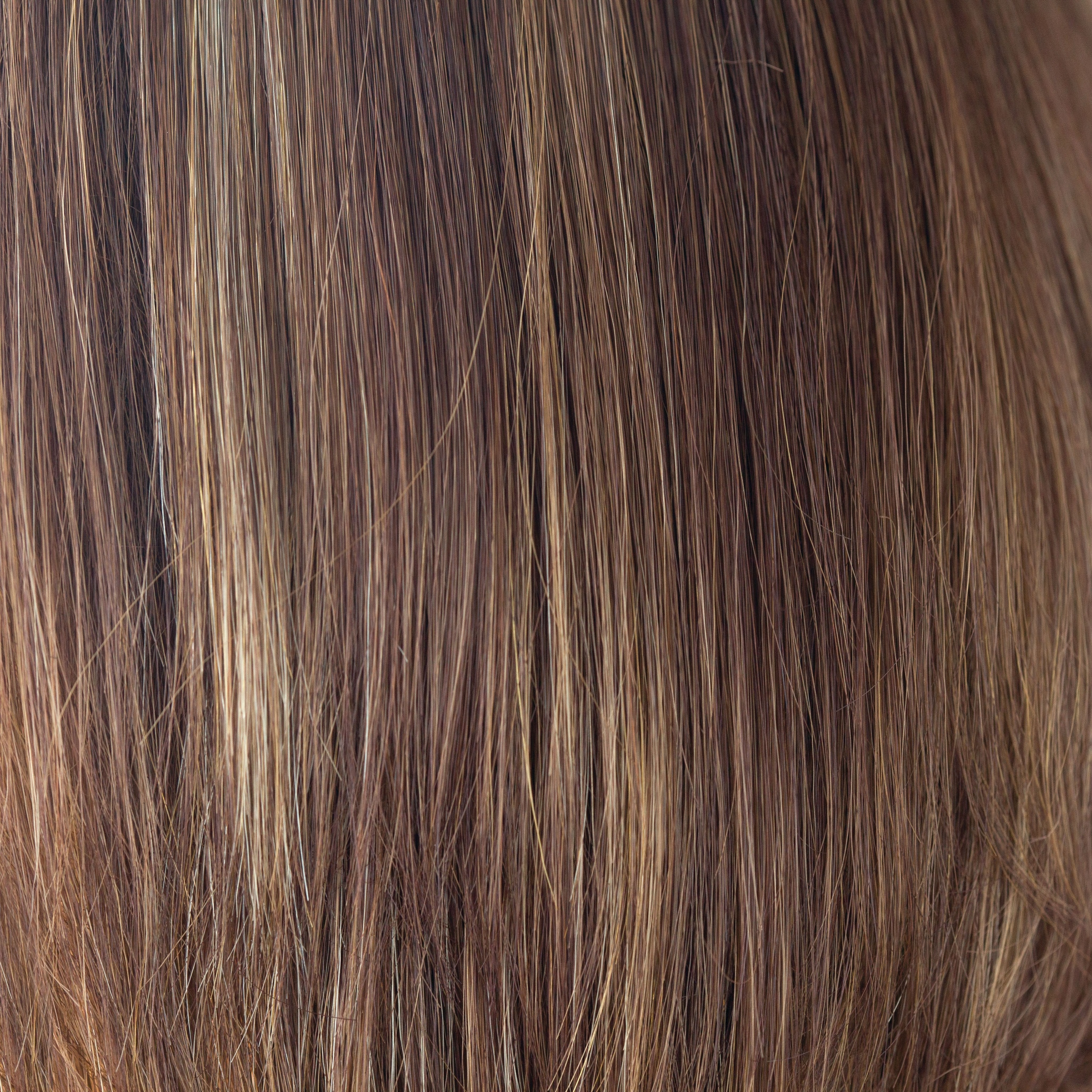 Coconut Spice  -  This medium red copper brown has a tasteful blend of lighter red and dark blonds. Coconut Spice has twists of pale coconut blonde shades throughout, spicing up this spectacular color. This continues to be a popular choice world over.