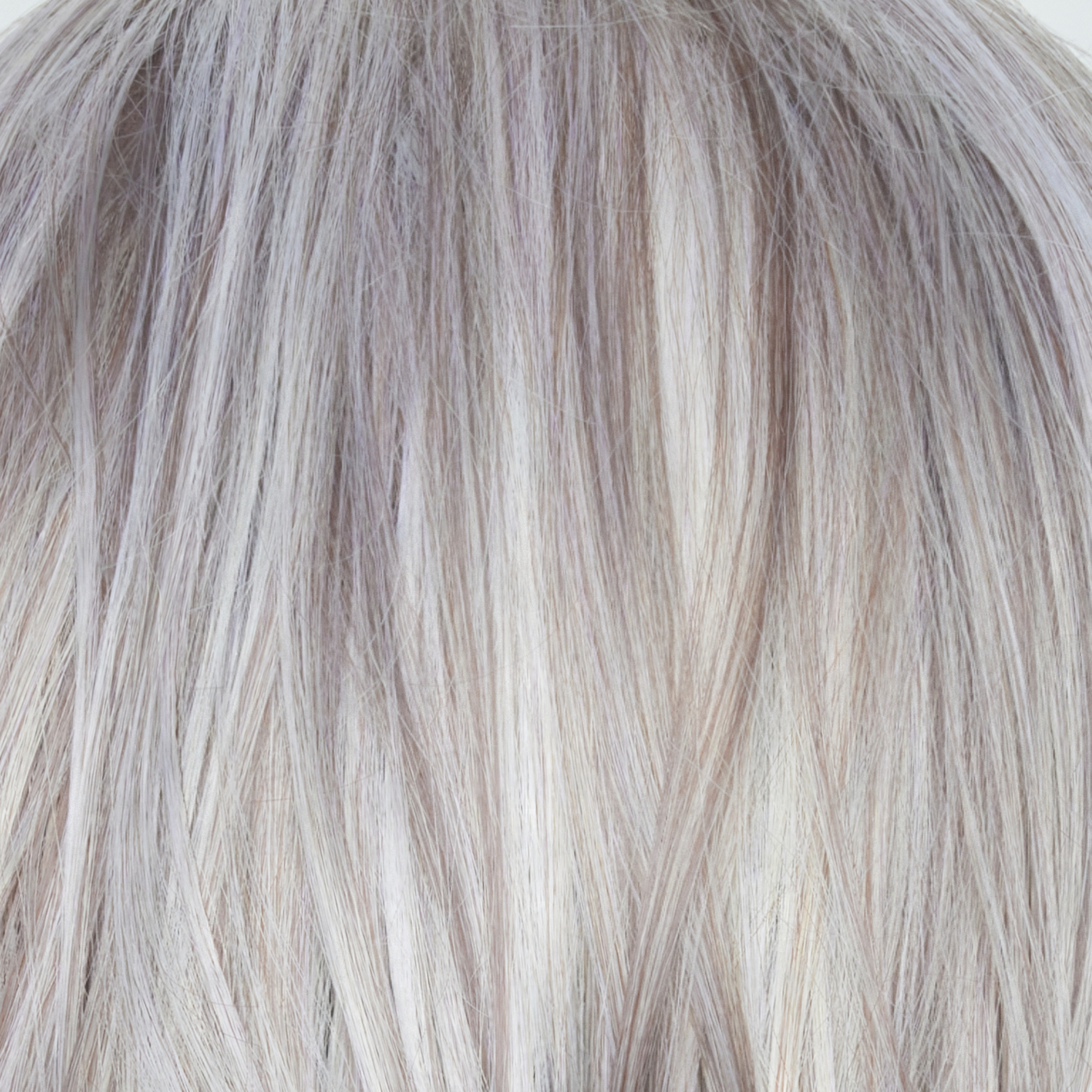 Frozen Mulberry  -  A stunning hair color that combines a pale white-grey platinum base with subtle lavender and frosted berry tones delicately woven throughout. This unique blend of highlights and purple toned lowlights adds texture and elegance to the overall look.