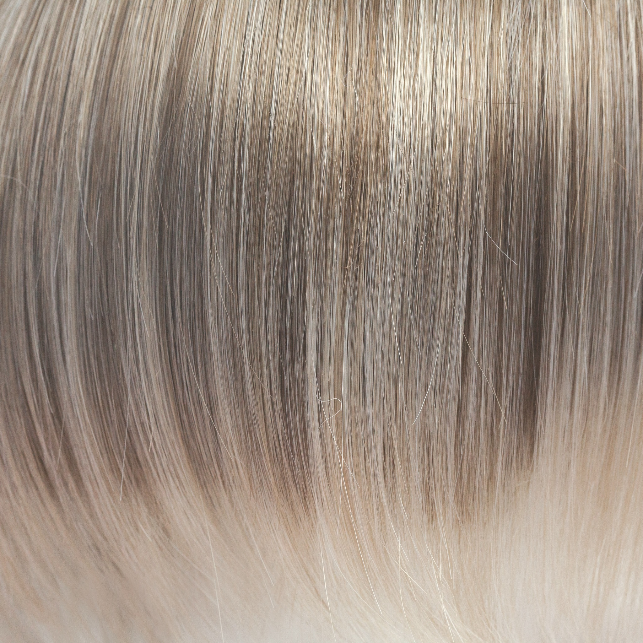 Ice Blond  -  This captivating clever color has a blend of beautiful ash blond highlights and velvet blonds. Towards the ends of the hair you are hit with blocks of ice blonde tips. This Ice Blond color combination is great in any style. It is crisp and coolâ€¦ we love it!