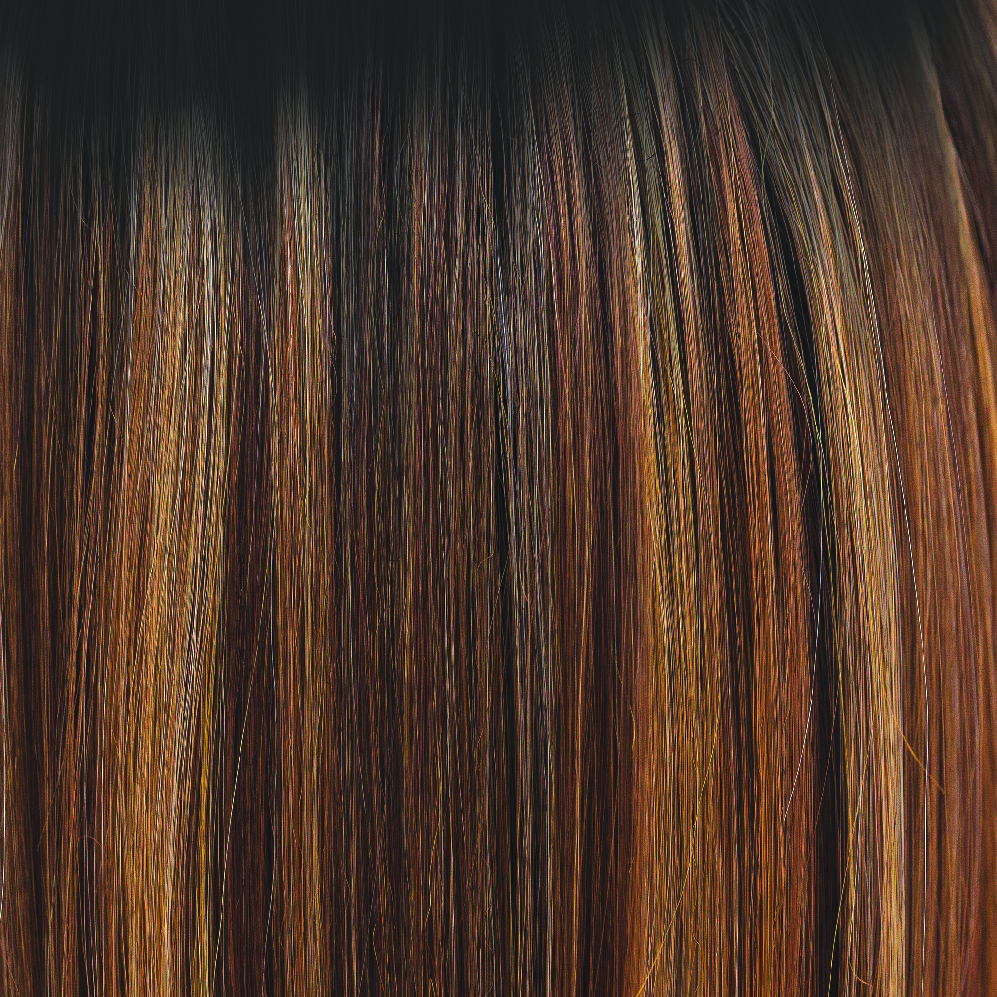 Molten Amber  -  A dark brown rooted color blending into chestnut and deep copper tones, with flecks of creamy golden fine blonds.Â Simply stunning and very wearable.Â Molten Amber oozes class and is a high heat color.