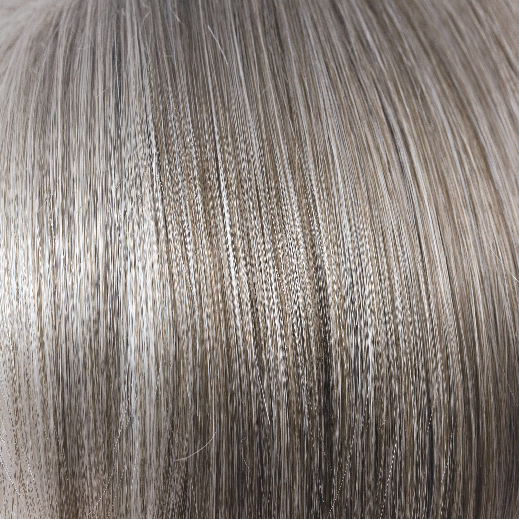 NM Sandy Silver  -  This gray tone is a warm, medium brown base with a mix of silvery white highlights. The color gradually goes from lighter at front to darker at nape. This color is perfect for those that love a gray color mixed with brown for a modern look!