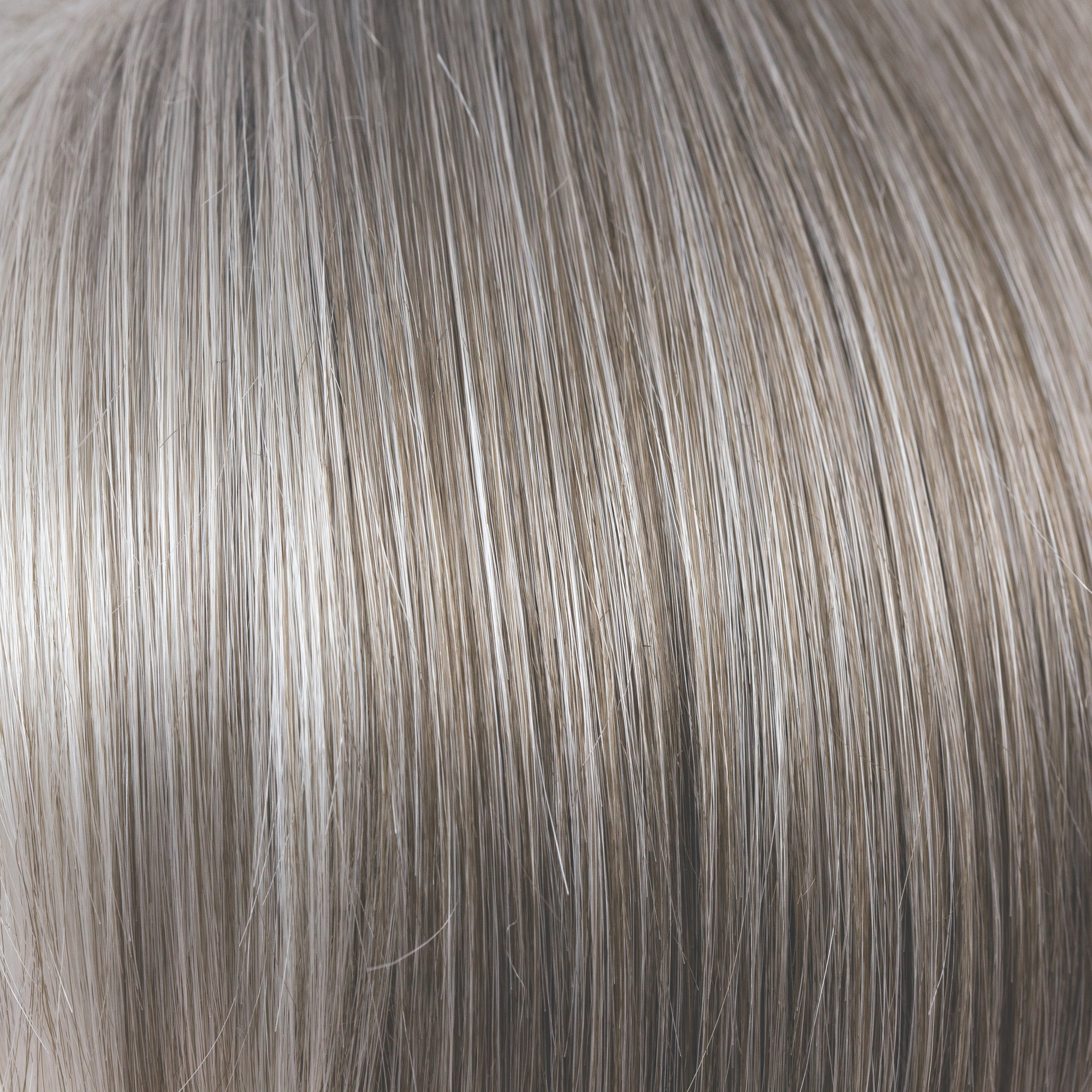 Sandy Silver  -  This gray tone is a warm, medium brown base with a mix of silvery white highlights. The color gradually goes from lighter at front to darker at nape. 